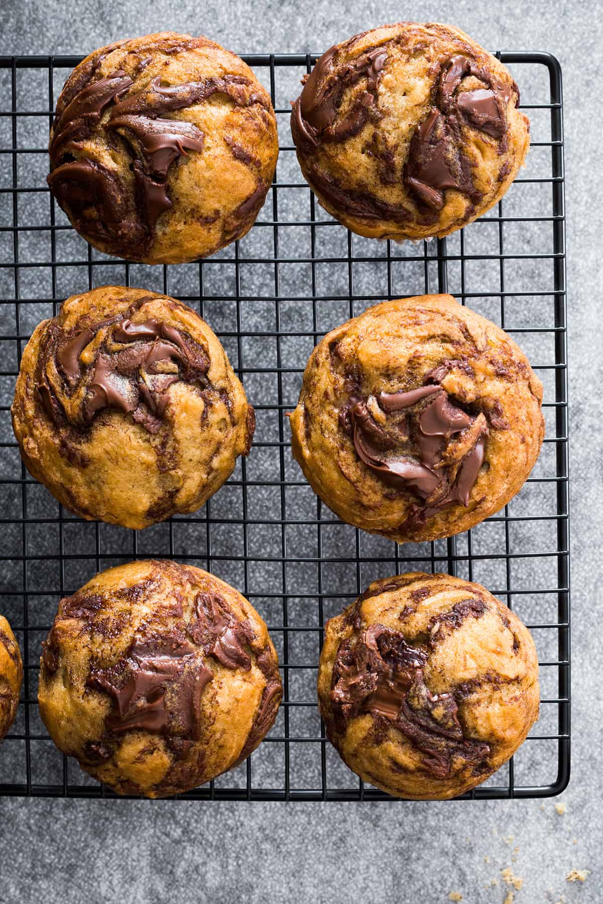 Banana Nutella muffins in a cooling rack.