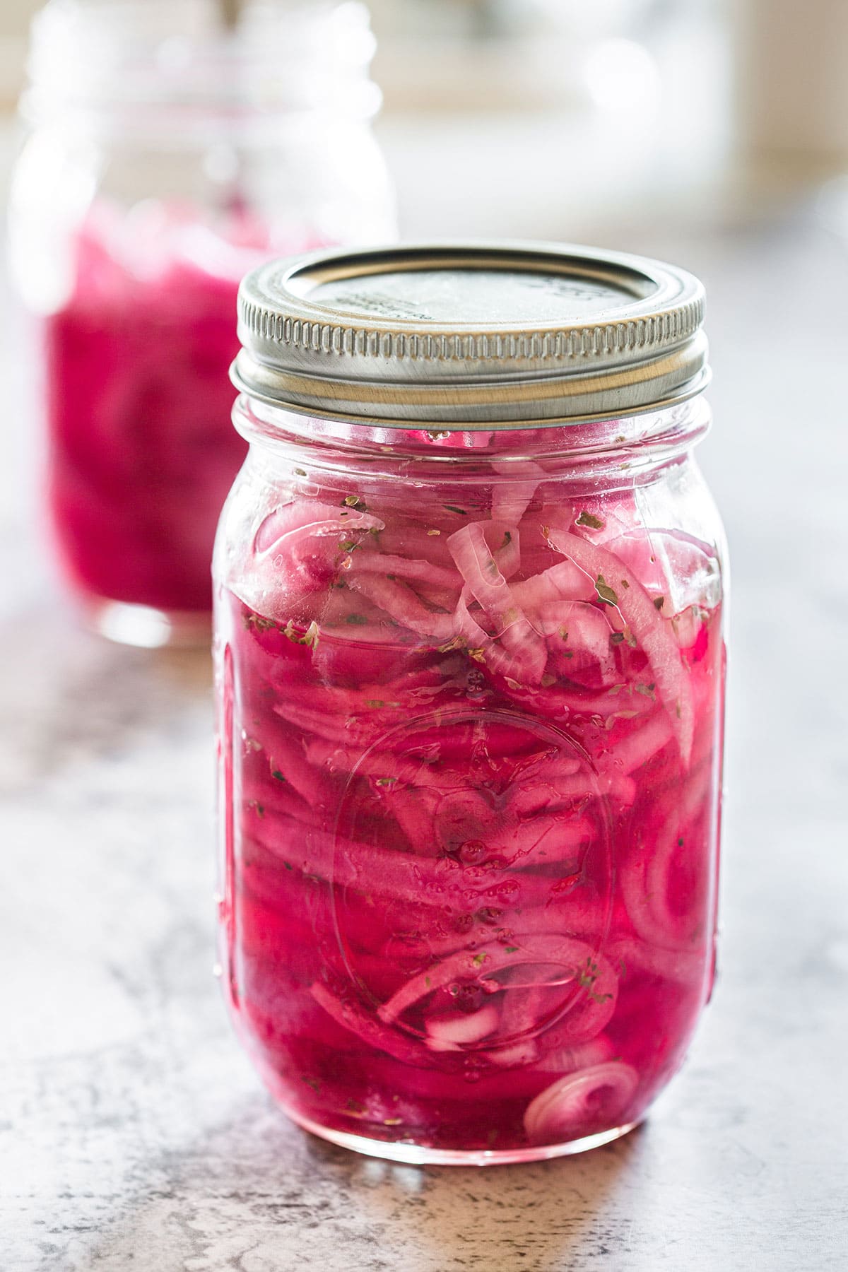 Cebollas curtidas - red Mexican pickled onions in a jar.