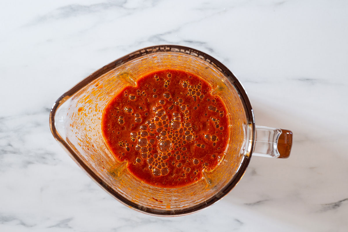 Chile rojo sauce in a blender.