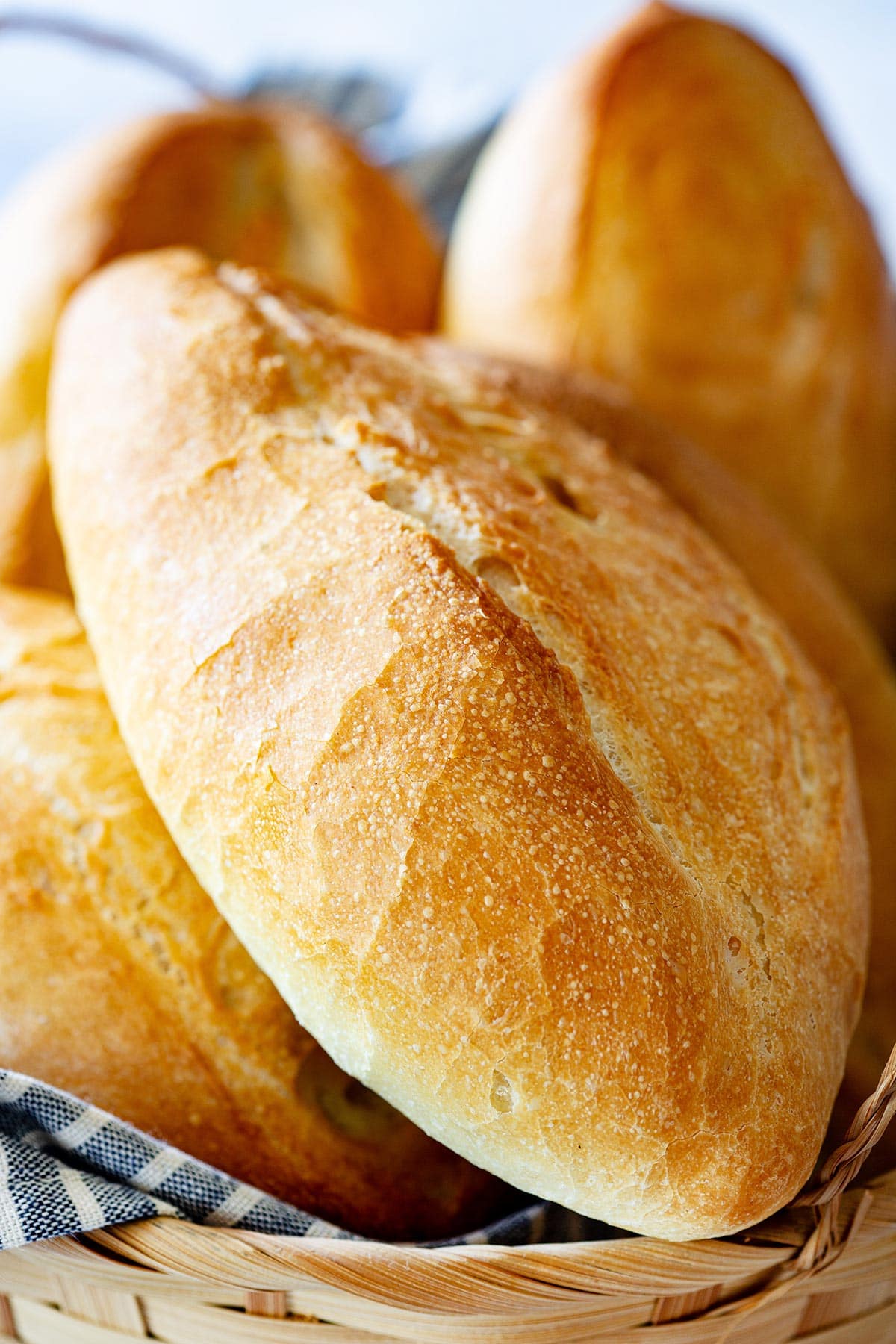 Close-up of bolillo bread to appreciate its crispy and shiny outside texture.