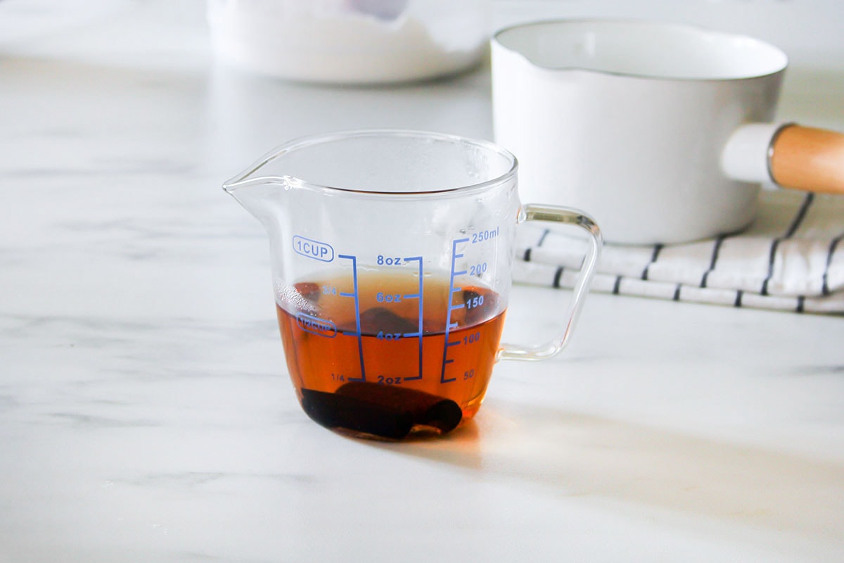 Cinnamon tea infusion in a cup.