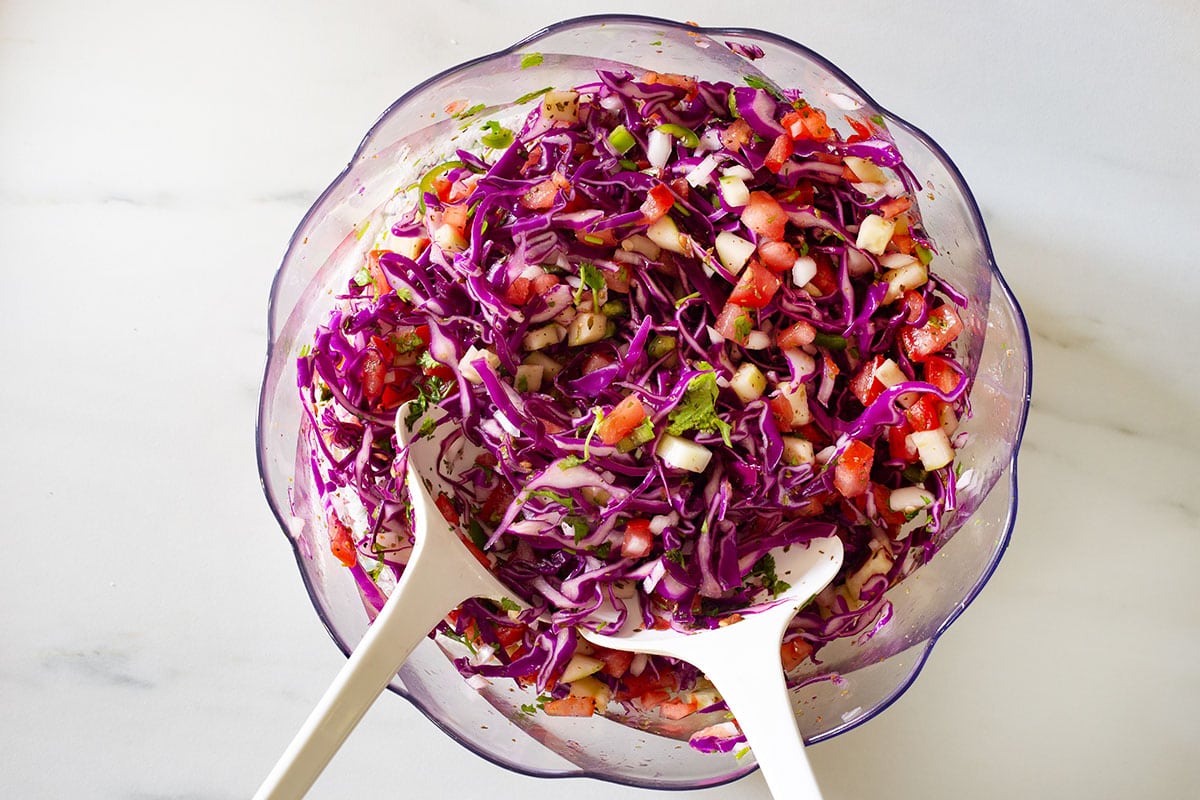 Read cabbage coleslaw in a bowl.