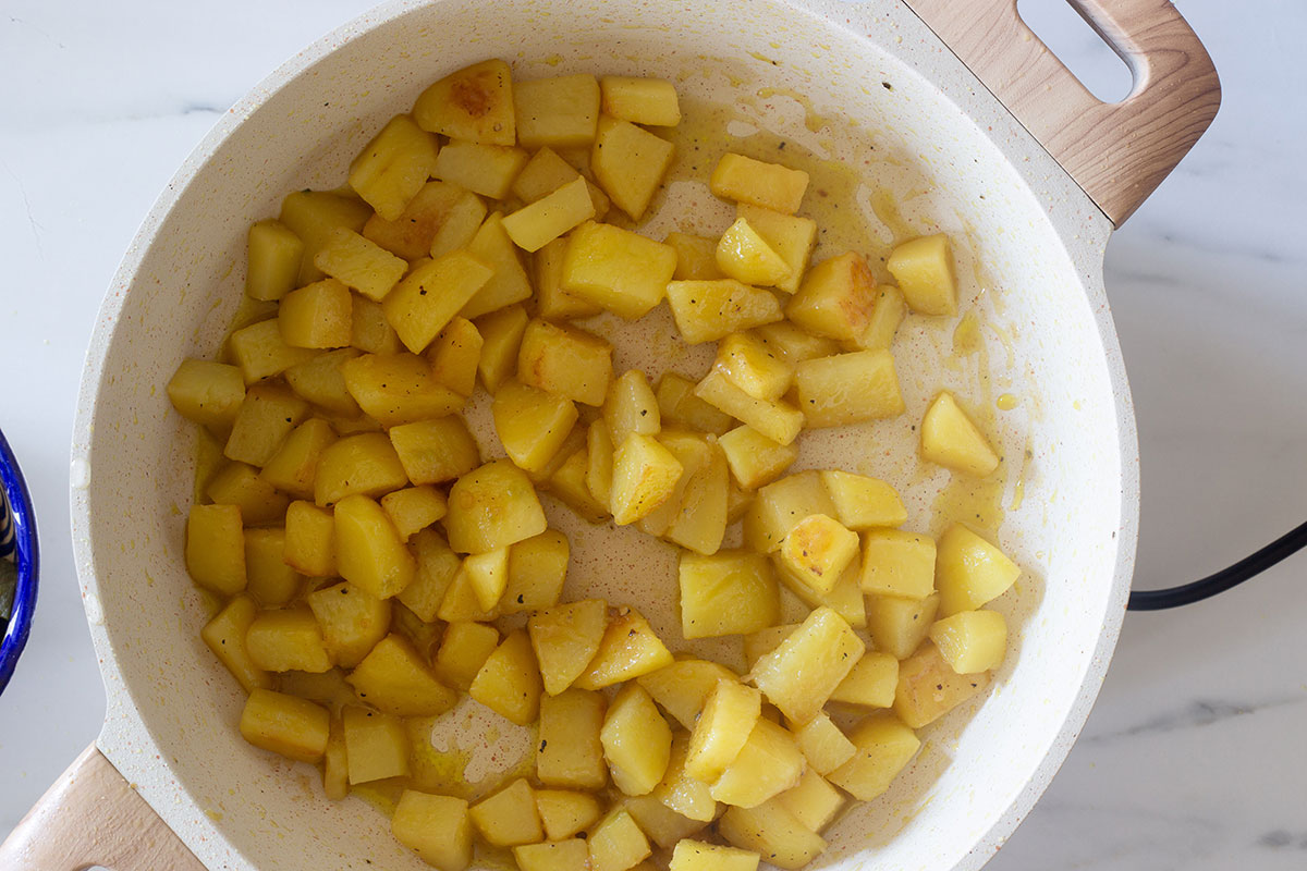 Frying potatoes on a pan.
